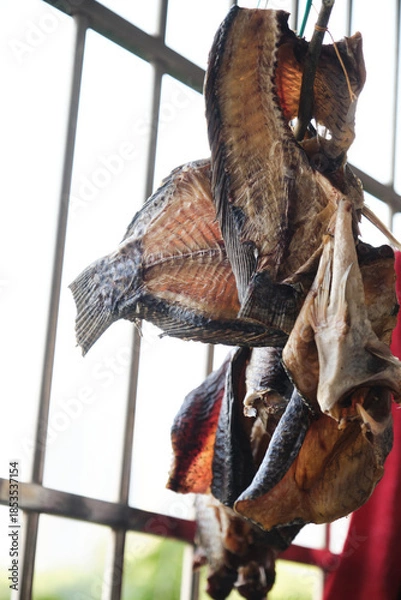 Obraz Close-up of dried fish hanging on the balcony to dry