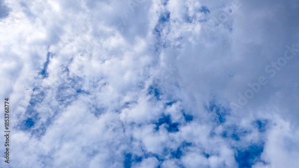 Obraz Dynamic Cloudscape on a Bright Blue Sky