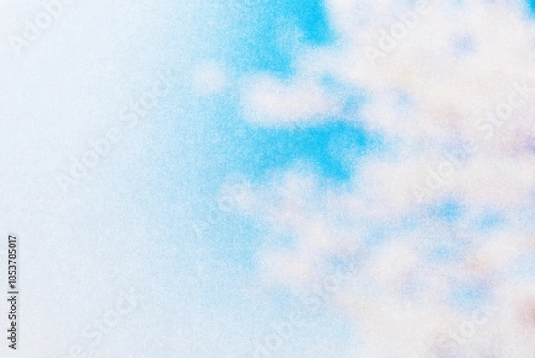 Obraz ざらざらの紙とぼやけた春の青空と桜の画像