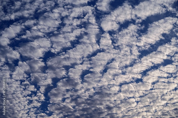 Obraz Beautiful cloudy sky with small fluffy white clouds.