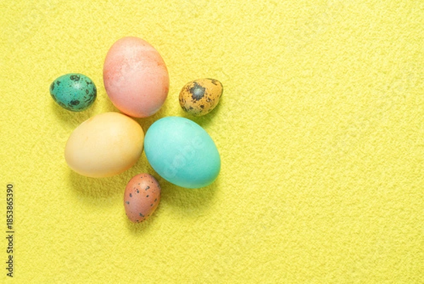Obraz Painted Easter eggs on yellow background