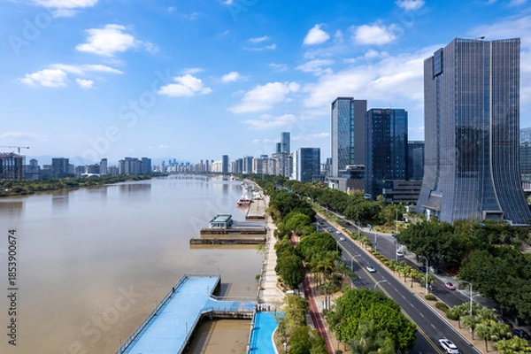 Obraz Modern Cityscape Along Riverside with Skyscrapers