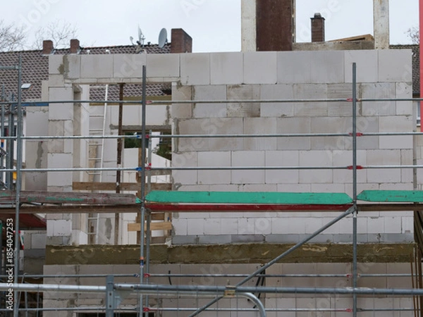 Obraz Demolition work on a construction site with concrete pillars, steel beams, etc.