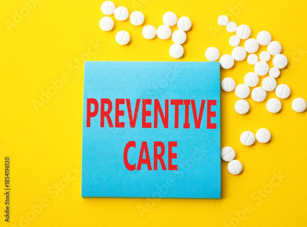Obraz Preventive Care symbol. Concept word Preventive Care on blue note. Beautiful yellow background with pills. Medicine and Preventive Care concept. Copy space