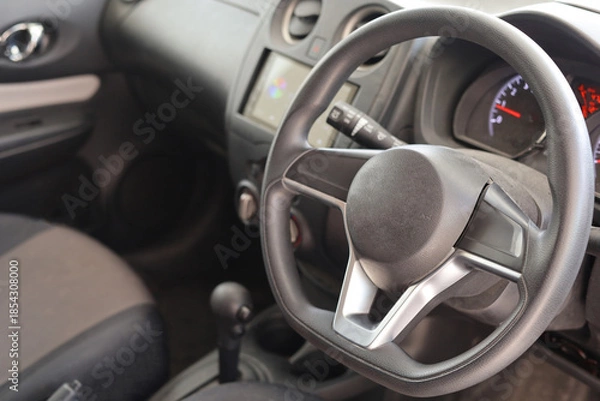 Fototapeta Modern Car Interior with Steering Wheel and Controls