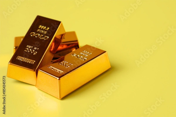 Obraz Stack of gold bars on yellow background