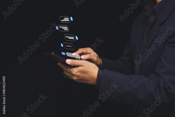 Obraz Business person using smartphone with digital chat interface.
