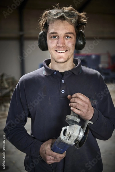 Obraz Happy working young farmer