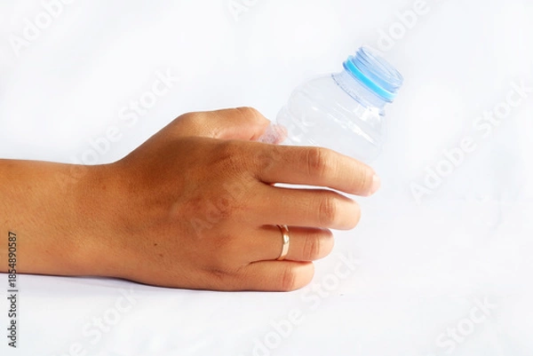 Obraz Hand Holding Clear Plastic Bottle with Blue Cap