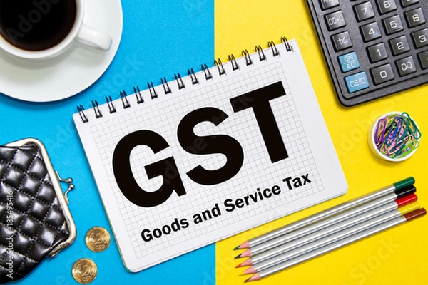 Fototapeta Goods and Service Tax notes in the notebook on the Desk in the office. Business concept GST tax