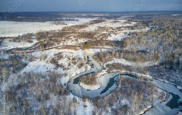 Obraz Aerial photo of Koen river under ice and snow. Beautiful winter landscape.