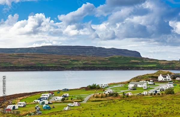 Fototapeta Coastal campsite with caravans beside bay in Scottish Highlands