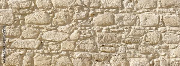 Obraz Stone wall texture closeup showing old rugged masonry