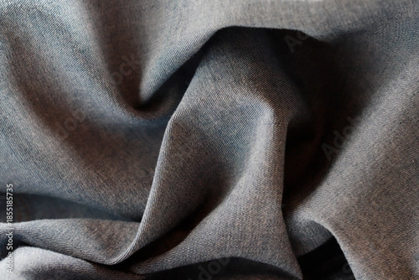 Obraz Dramatic lighting on denim fabric. Background, wallpaper.