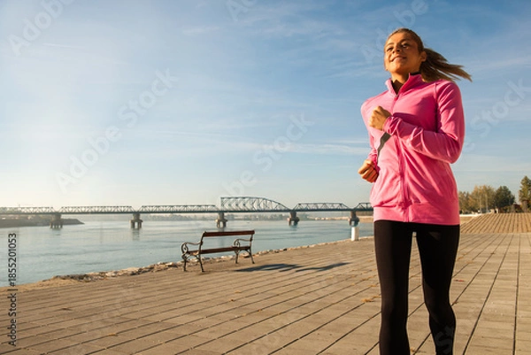 Obraz Healthy happy runner city running at sunset.