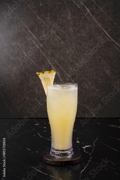 Obraz Yellow Cocktail with Lemon Garnish.