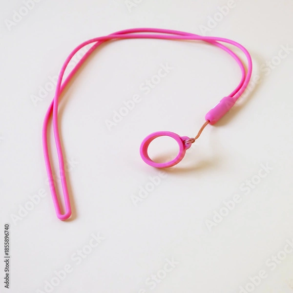 Obraz Pink eyeglass strap on color background.