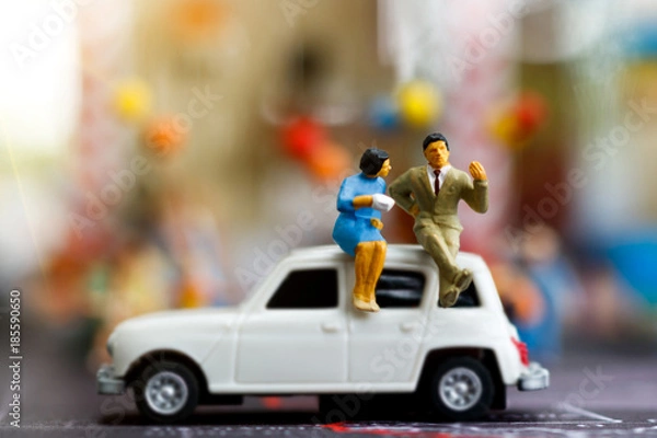 Obraz miniature people Sitting on the  car on the map. break time of business concept.