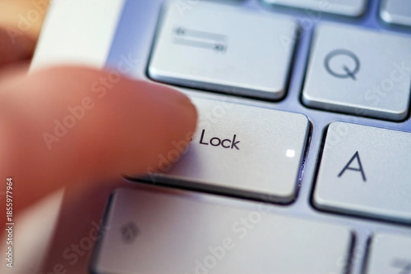 Obraz Close-up computer keyboard keys and finger, top view.