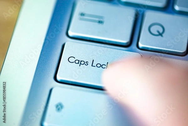 Obraz Close-up computer keyboard keys and finger, top view.