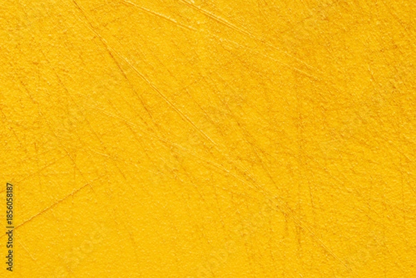 Fototapeta Yellow used plastic chopping board surface texture