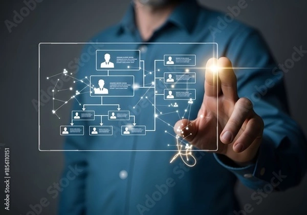Obraz Man interacting with digital organizational chart on transparent screen interface display technology