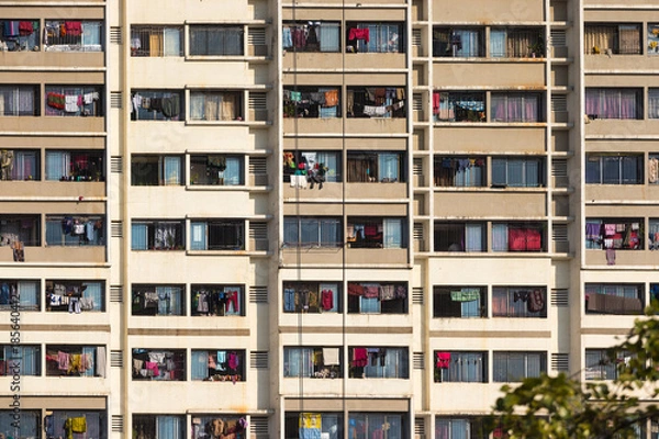 Obraz Section from the exterior of an residential building, all balconies full of laundry hanged, Mumbai, India