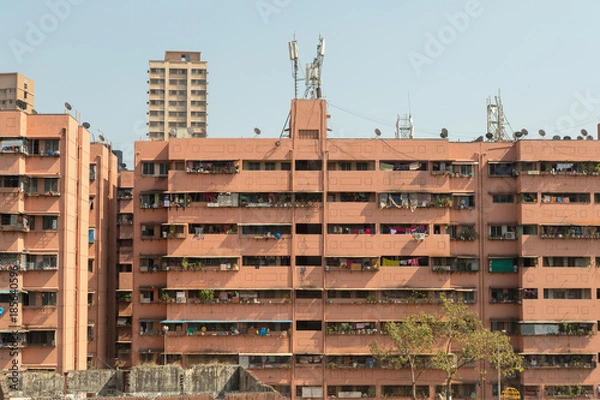 Obraz Section from the exterior of an residential building, all balconies full of laundry hanged, Mumbai, India