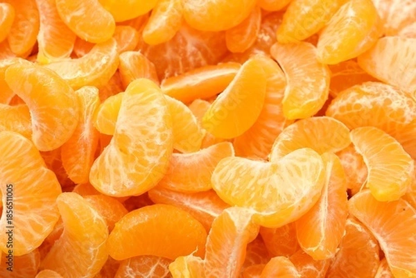 Obraz Many ripe peeled tangerines as background, top view