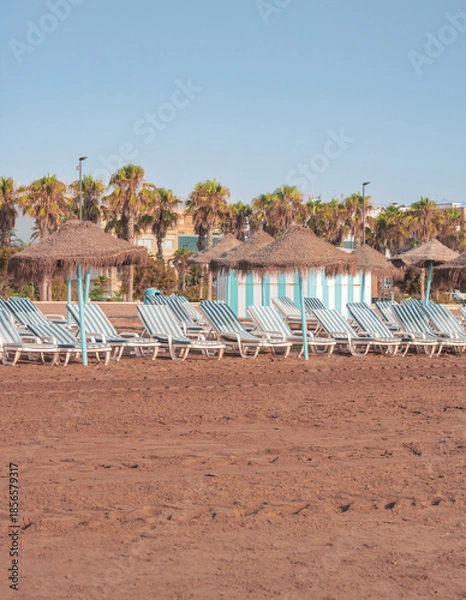 Obraz beach with umbrellas and chairs