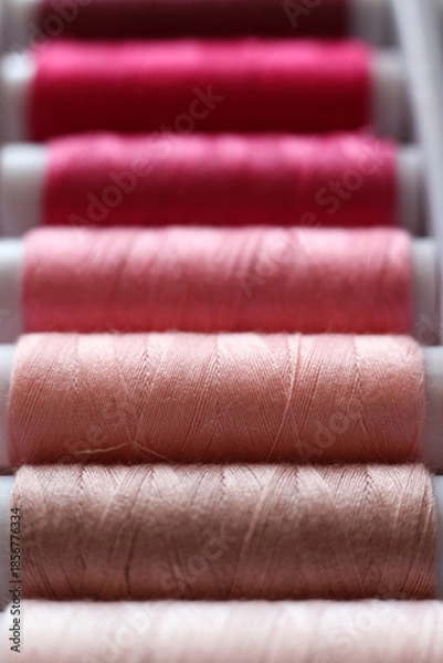 Fototapeta Pink Sewing Thread Spools – Macro Textile Texture