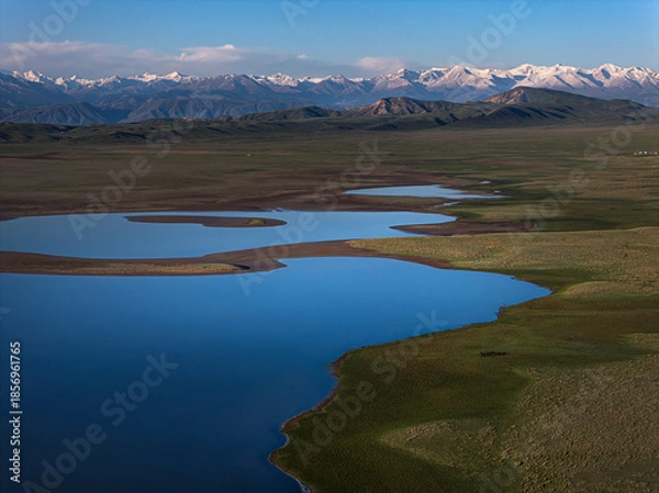 Obraz a mountain lake under snow-capped mountains