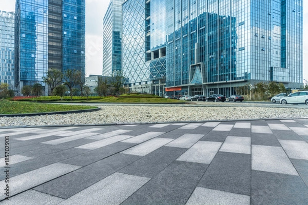 Fototapeta modern buildings and empty pavement in china.