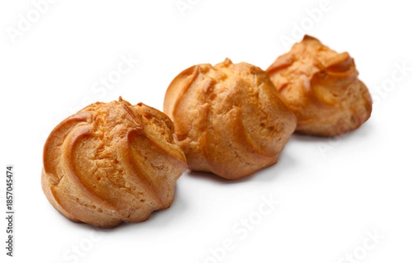 Obraz Three delicious golden profiteroles isolated on white