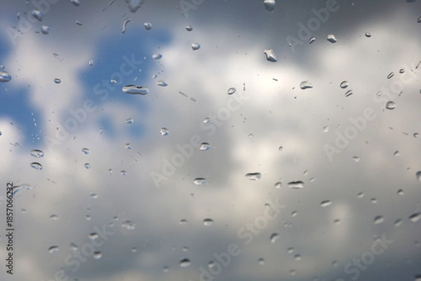 Obraz Raindrops On Window With Cloudy Sky