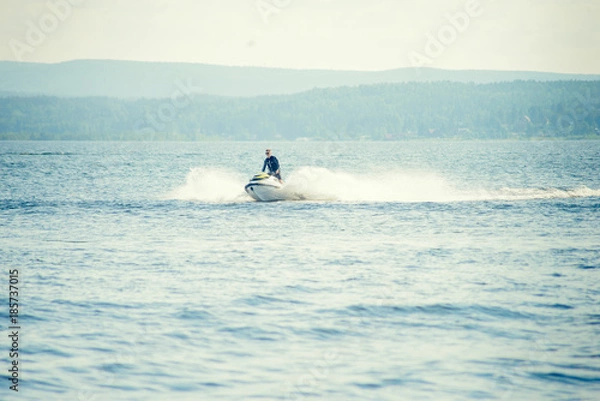 Obraz Dona Paula, Goa, India - February 15, 2017: Tourist enjoy water scooter ride in the sea around Dona Paula in Goa, India.