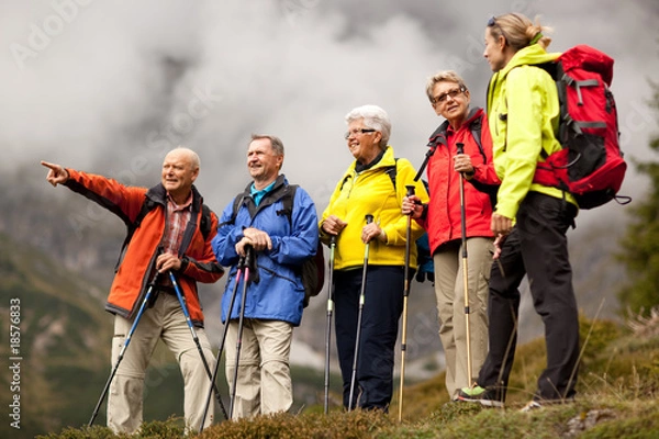 Fototapeta senior hiker pointing at something