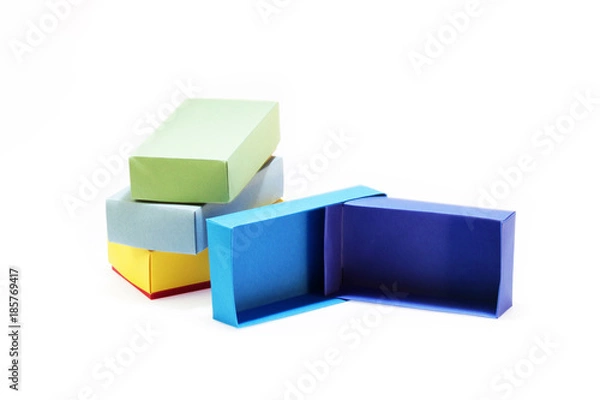 Obraz Few colorful paper boxes of colored cardboard for packing bow ties and other gifts on a white background. Hand made