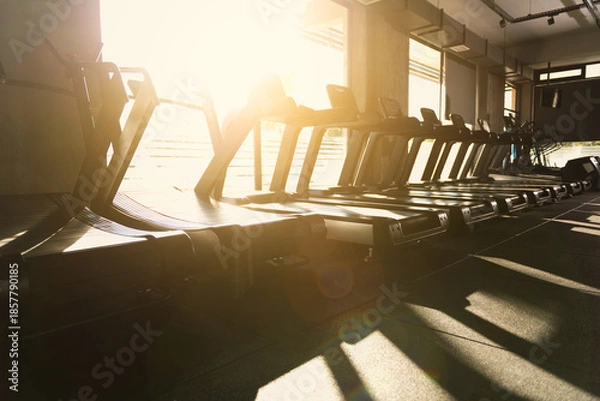 Obraz Sunset Backlit Treadmills in Gym Photo