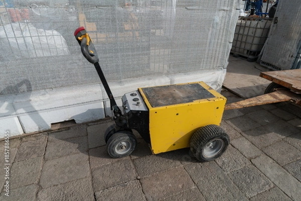 Obraz Small electric tow tractor for carts in industrial area