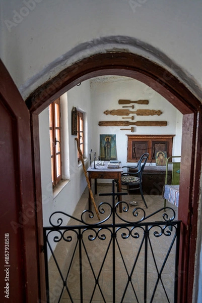 Obraz View Through Iron Gate into Monk Room