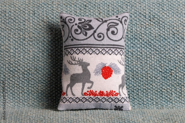Obraz Festive cushion with deer on a sofa