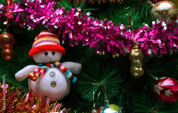 Fototapeta Artificial Christmas tree with toys and a snowman