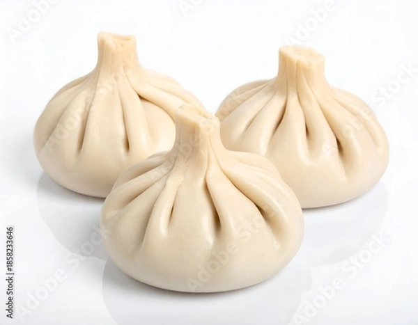Obraz Three dumpling-like food items, white background, soft lighting