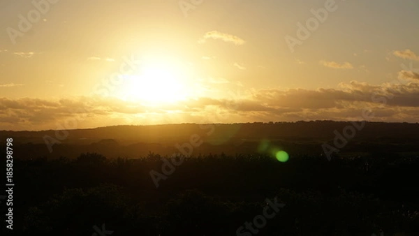 Obraz 雲の間から差し込む朝日