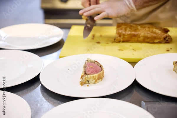 Obraz hand holding a plate with food