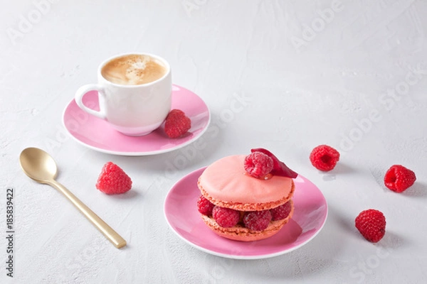 Fototapeta Romantic breakfast with coffee and pink raspberry macaron