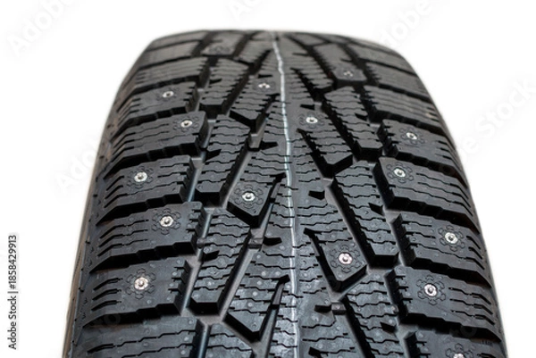 Obraz Winter tires with studs on a white background