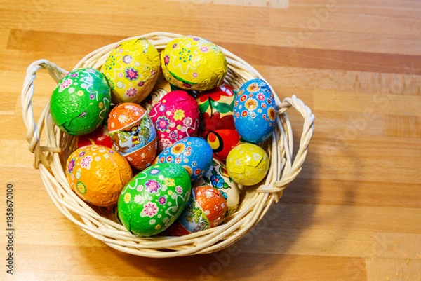 Obraz Basket with Easter eggs on wooden table