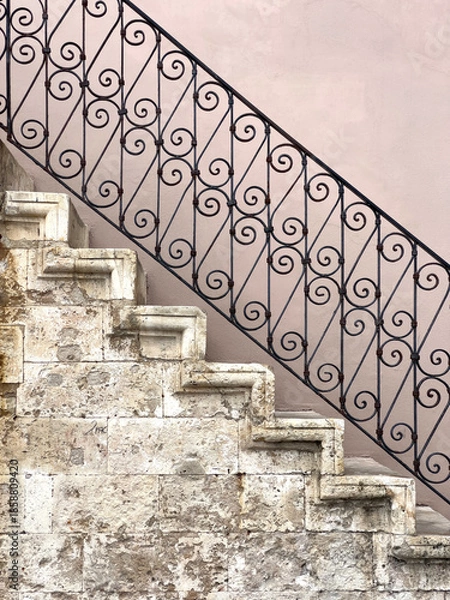 Obraz Ancient stone staircase with wrought iron railing detail